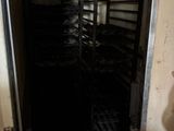 a room with a bunch of racks of food in it