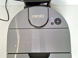 an image of a neatto vacuum cleaner on a wall