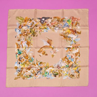 a picture of a square scarf with a picture of birds and flowers on it
