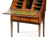 an antique writing desk with a green top and two drawers