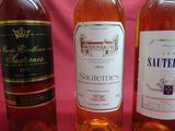 several bottles of wine are lined up on a table