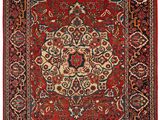un tapis rouge et bleu à motifs de médaillons