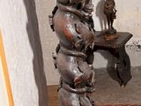 a lamp that is sitting on a stand in a room