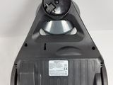 a close up of a black object on a white surface