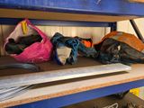 a shelf that has a bunch of bags on top of it