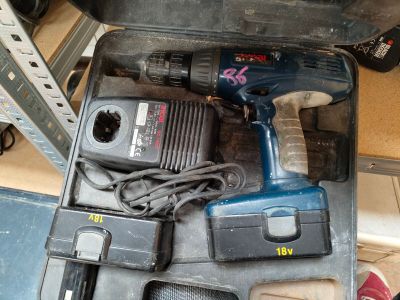a tool box with a drill, drill, and other tools in it