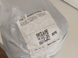 a plastic bag with a qr code on it sitting on a counter