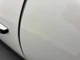 a close up of a car door handle with a sticker on it
