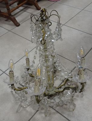 a chandelier that is sitting on the floor in the room