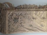 an old purse with a lace on it sitting on a table