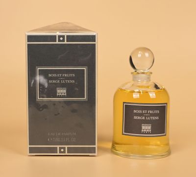an image of a bottle of perfume next to a box