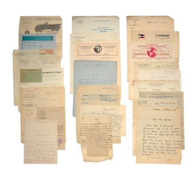 several old papers are stacked on top of each other on a white surface