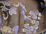 a close up of a purse on a table