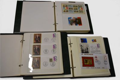 a black binder with stamps on it and a picture of a man in a suit