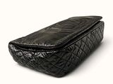 an image of a black purse on a white background