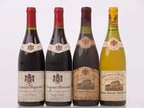 trois bouteilles de vin sont posées les unes à côté des autres sur une surface blanche