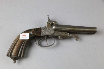 a close up of a gun on a table with a tag on it