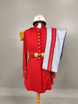 a red uniform on a mannequin with a white hat and a blue scarf