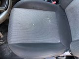 a car seat that has been left in the back of the car