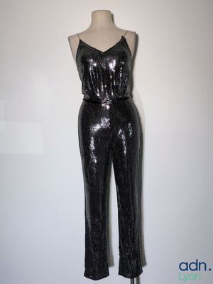 black sequinized jumpsuit on a mannequin mannequin mannequin mannequin mannequin mannequin mannequin mannequin