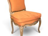 an image of a chair with an orange upholstered seat