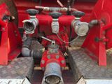 a red fire hydrant sitting in the back of a truck