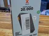 packaging of a box on a wooden table with a computer in the background
