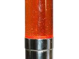 an orange light that is on top of a metal stand