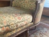 a chair that is sitting on a rug in a room