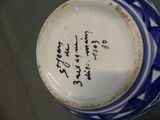 a blue and white vase with writing on it