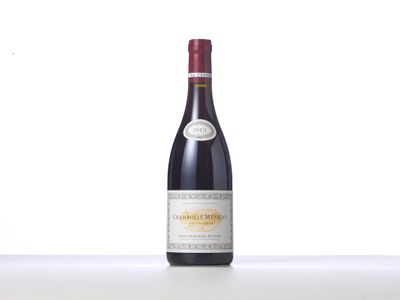 a bottle of red wine sitting on top of a table