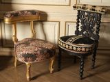 two chairs sitting next to each other on a wooden floor