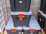 many plastic boxes stacked on top of each other in a warehouse