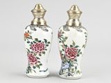 pair of chinese vases with flowers and birds painted on them
