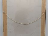 an old photo of a piece of paper with a rope on it