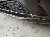 a close up of a car ' s front bumper and grille