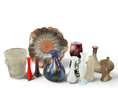 a lot of glass vases that are sitting on a table