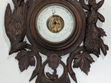 a clock hanging on the wall with a clock in the middle