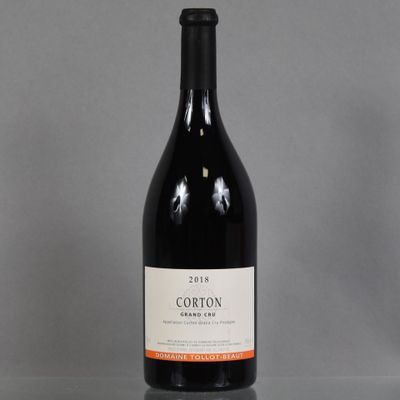 a bottle of red wine sitting on a table