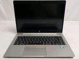 an open laptop computer sitting on top of a white table