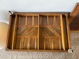 a wooden tray with compartments that are open on the floor