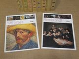 two books on a table with a picture of a man in a straw hat
