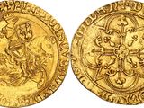 a gold coin with an image of a man on a horse