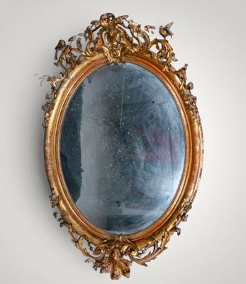 a mirror hanging on the wall in a room