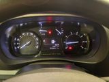 a close up of a car dashboard with a speedometer and gauges