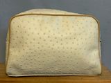 an image of a white purse sitting on top of a wooden table