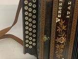 an old accordion that is sitting on a table