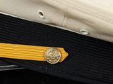 a close up of a military hat with a medal on it