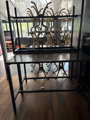 a table that has a metal frame on top of it