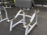 a picture of a gym room with a row of exercise equipment
